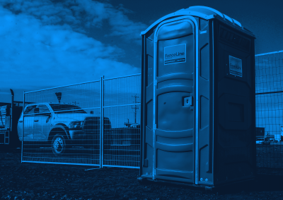 Fenceline portable toilet with a Fenceline truck in the background