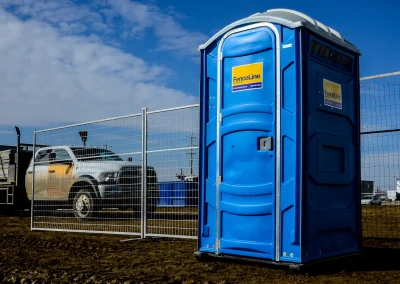 Porta Potty and portable fence at a construction site