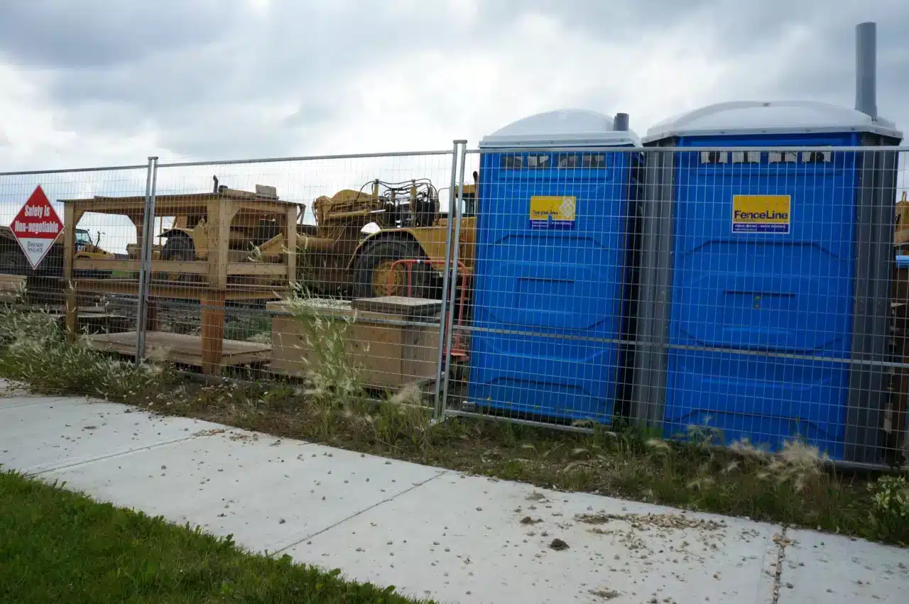 Temporary fencing for construction set up around a construction site in Edmonton.