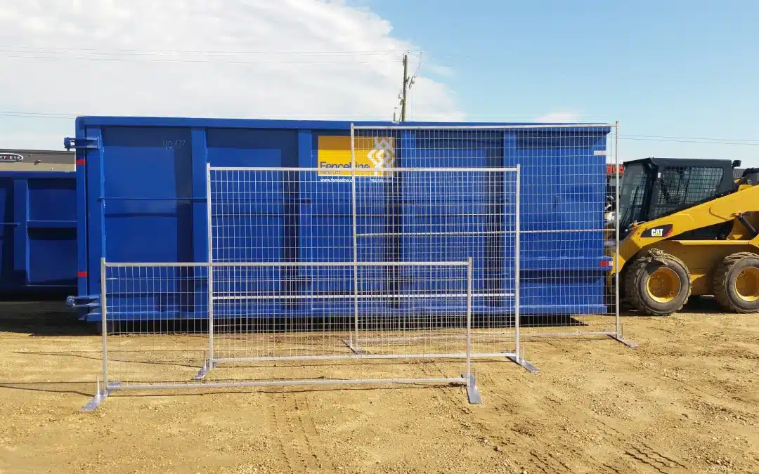 Different sizes of temporary fencing for construction in front of a waste bin in Edmonton.