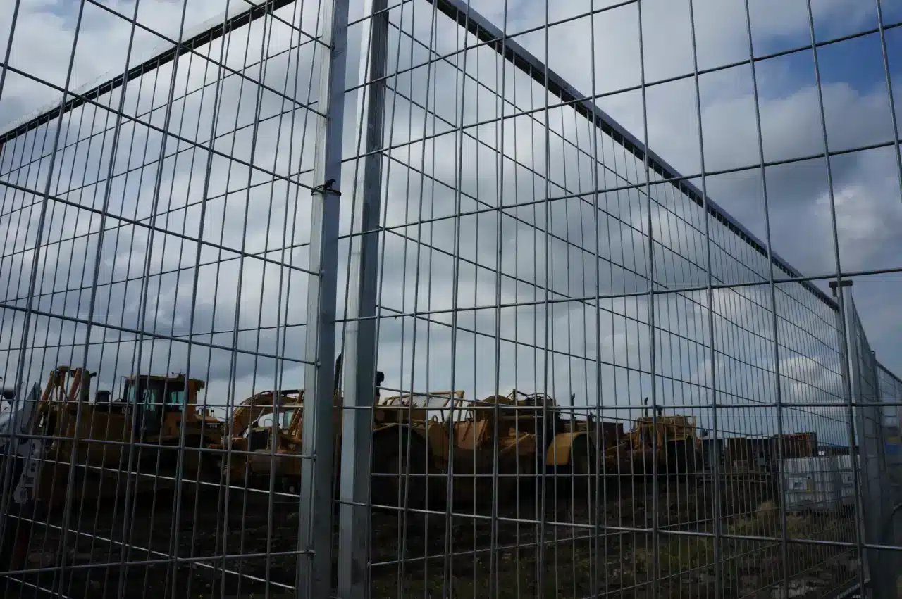 temporary fencing provides separation to areas on an industrial site.