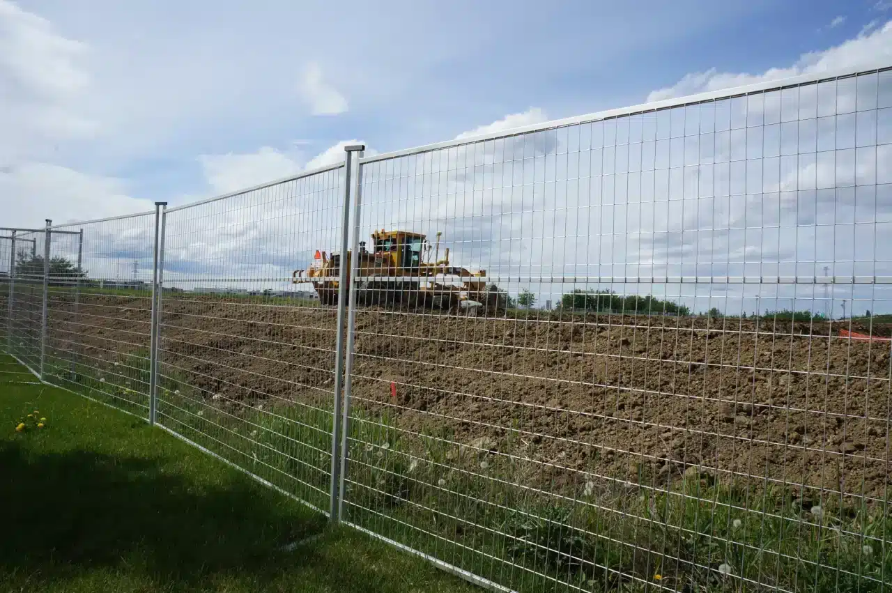 Temporary fencing surrounds a construction site in Alberta