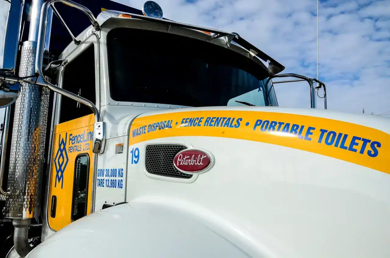 A FenceLine truck that delivers portable toilets across Alberta