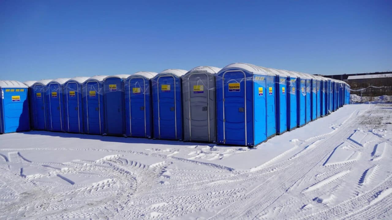 Rows of new portable toilets are ready for wholesale at a warehouse in Acheson.