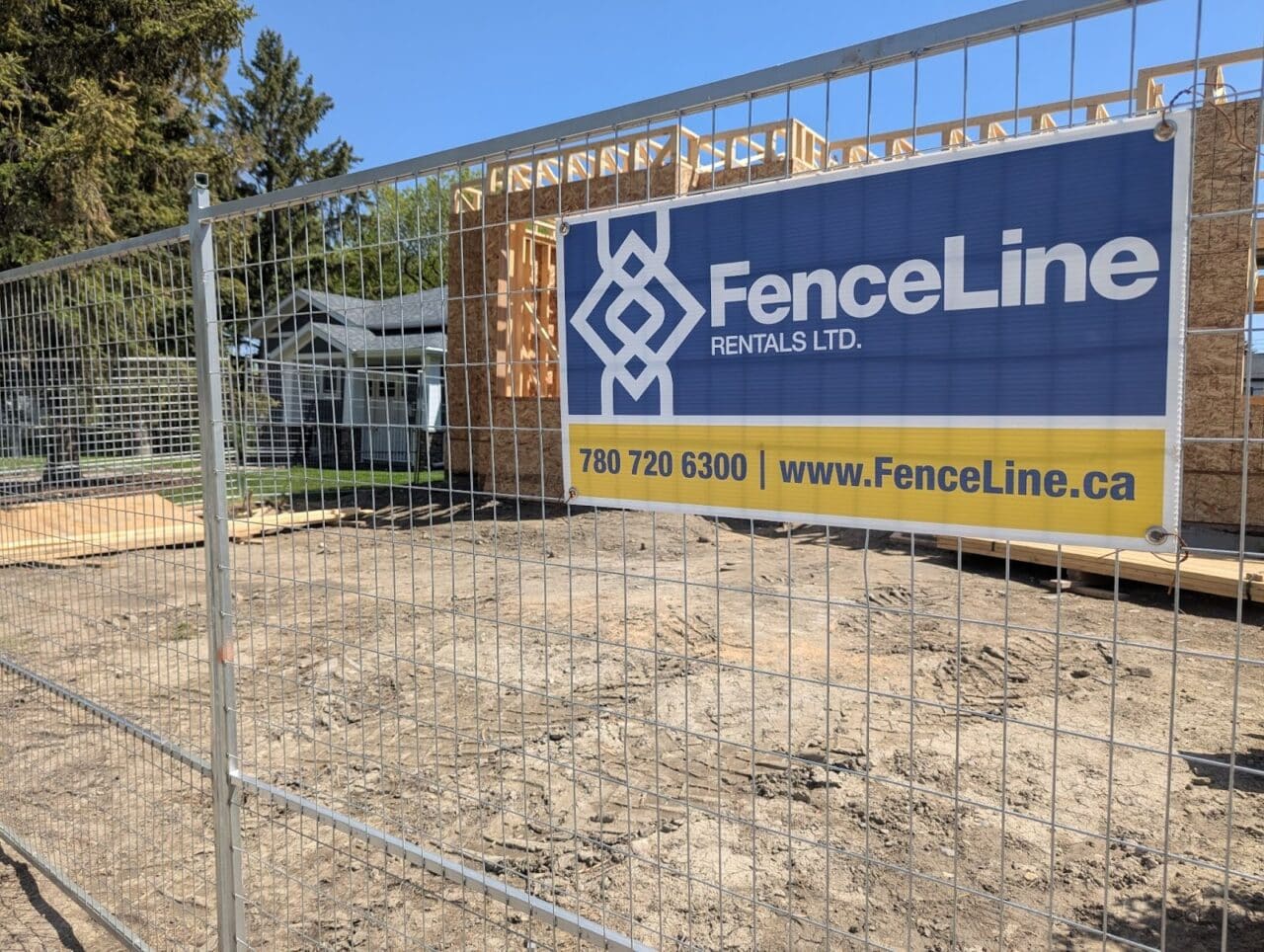 Temporary fencing surrounds a home construction site in Calgary