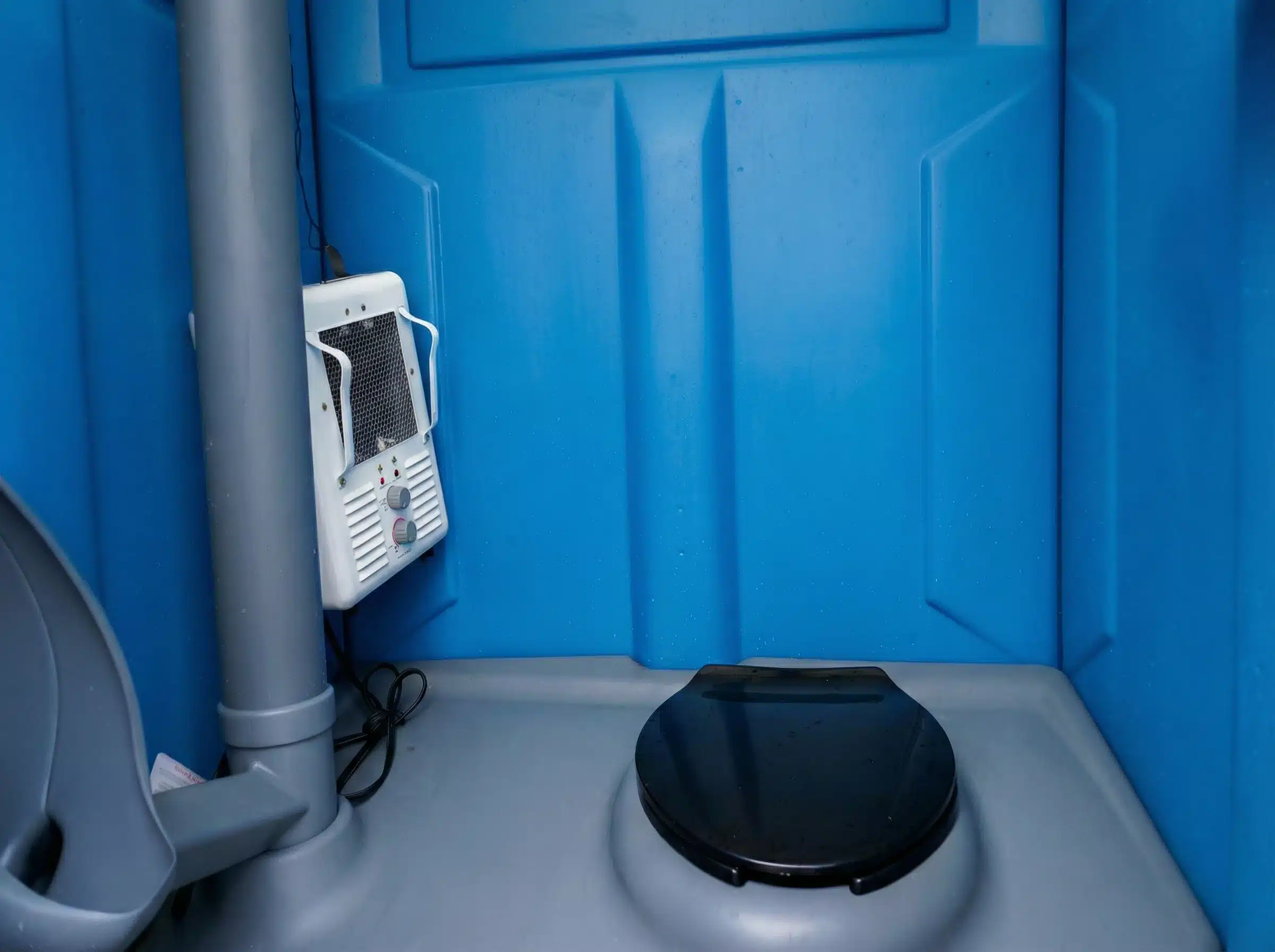 Portable toilet heater