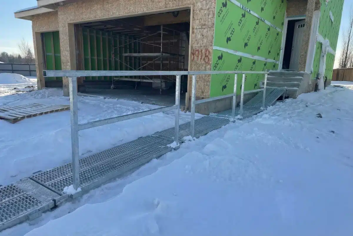 Temporary walkway plank with handrails