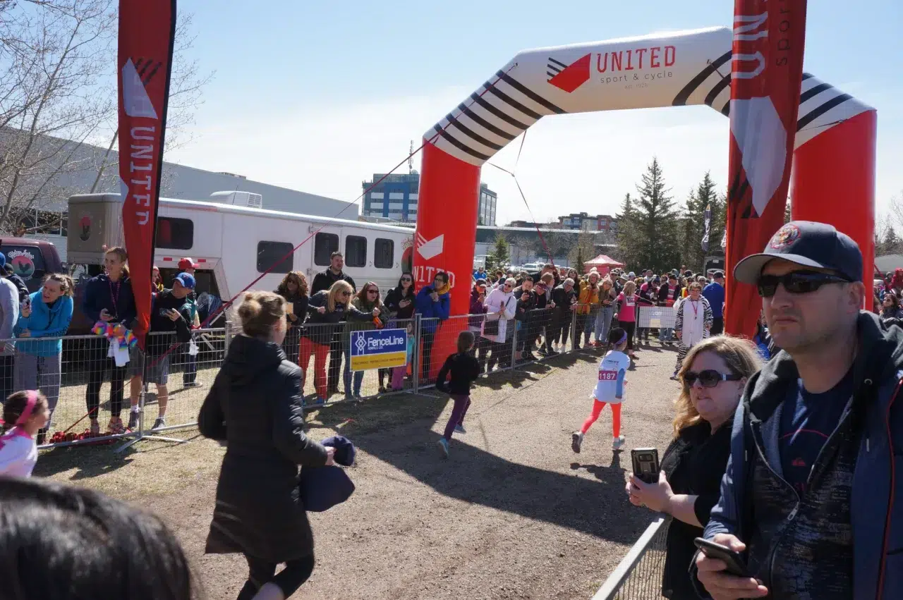 Crowd control barriers designate the start of a kids' running race in Edmonton.
